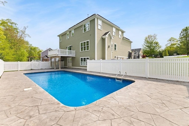 view of swimming pool with a patio and a fenced backyard