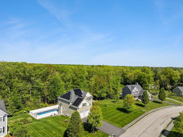 aerial view of a forest and a pool
