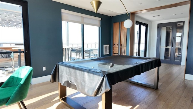 game room with hardwood / wood-style floors and billiards