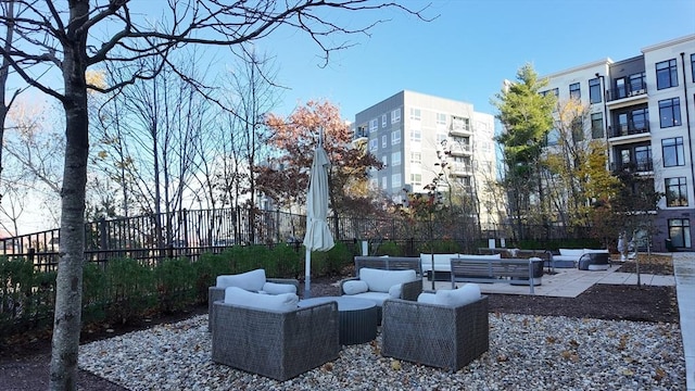 view of property's community featuring a patio area and an outdoor living space