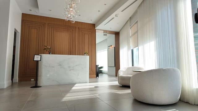 reception area featuring an inviting chandelier