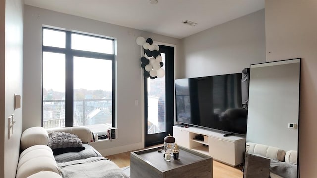 living room with light hardwood / wood-style floors