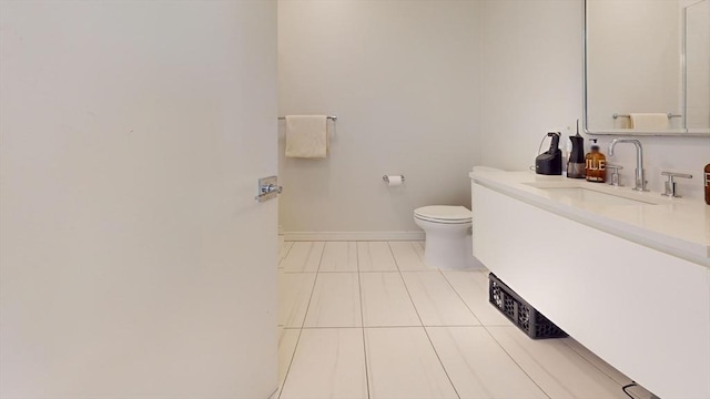 bathroom with toilet, tile patterned flooring, and vanity