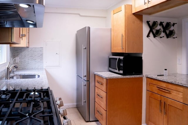 62 Roberts Dr Unit 62, Bedford, MA 01730 - kitchen featuring stainless steel appliances, exhaust hood, a sink, decorative backsplash, and light stone counters