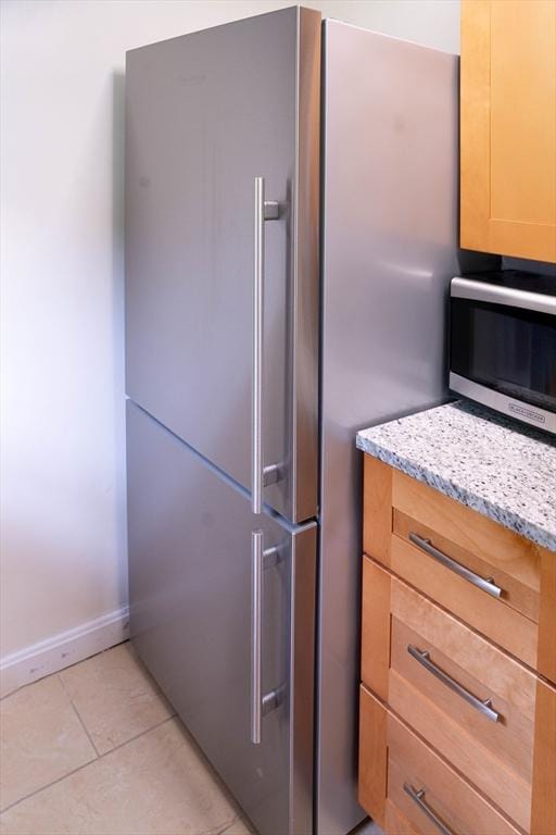 62 Roberts Dr Unit 62, Bedford, MA 01730 - kitchen view of stainless steel appliances, light stone countertops, and baseboards