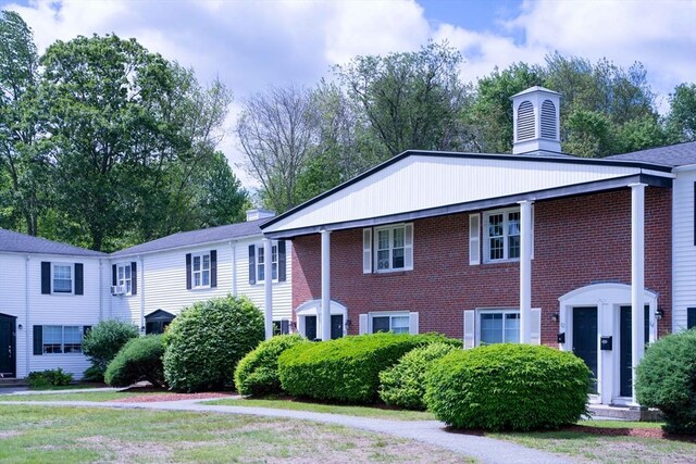 62 Roberts Dr Unit 62, Bedford, MA 01730 - neoclassical home featuring a chimney and brick siding
