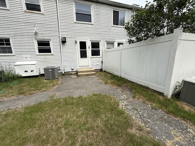 62 Roberts Dr Unit 62, Bedford, MA 01730 - rear view of house featuring entry steps and central AC