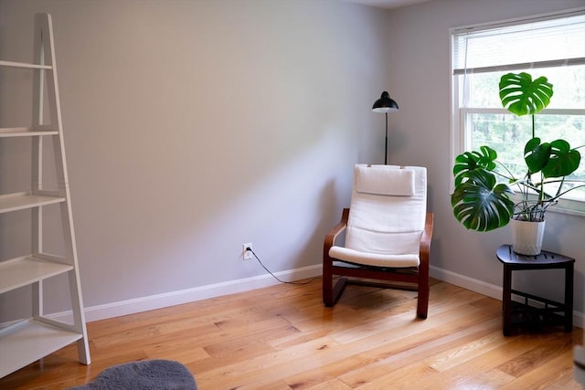 62 Roberts Dr Unit 62, Bedford, MA 01730 - sitting room with light wood-style floors and baseboards