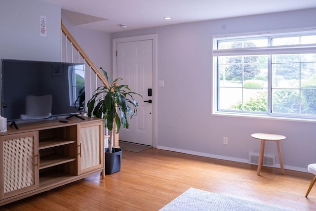 62 Roberts Dr Unit 62, Bedford, MA 01730 - entrance foyer with light wood-style flooring, baseboards, recessed lighting, and stairway