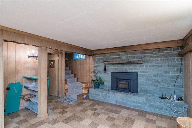 5 Norman Cir, Montague, MA 01376 - unfurnished living room with wood walls, stairs, and carpet floors