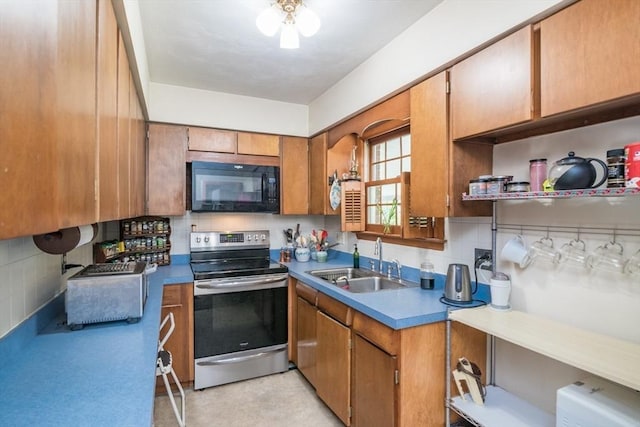5 Norman Cir, Montague, MA 01376 - kitchen with black microwave, stainless steel electric range oven, brown cabinetry, and backsplash