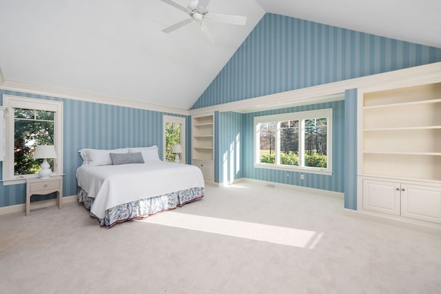 bedroom with ceiling fan, carpet floors, and lofted ceiling