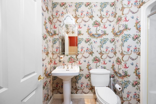 bathroom featuring tile patterned flooring and toilet