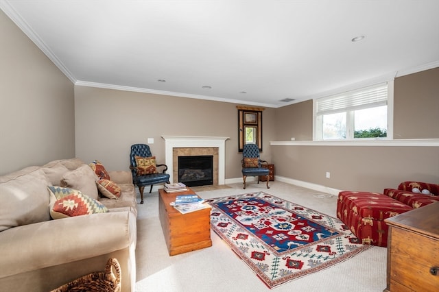 living room with a tile fireplace, carpet, and ornamental molding