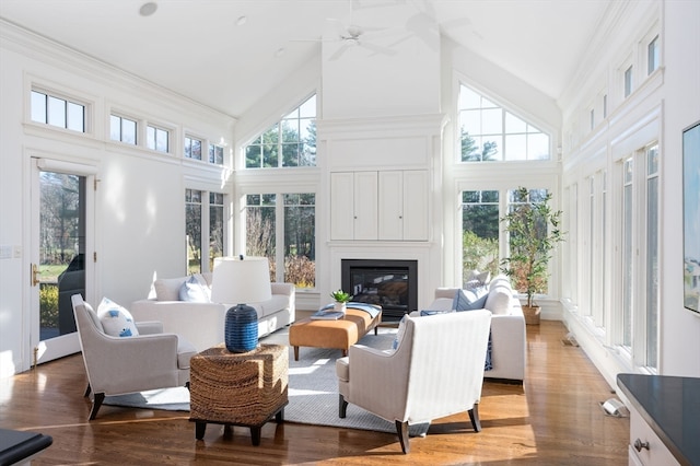 sunroom featuring vaulted ceiling, a wealth of natural light, and ceiling fan