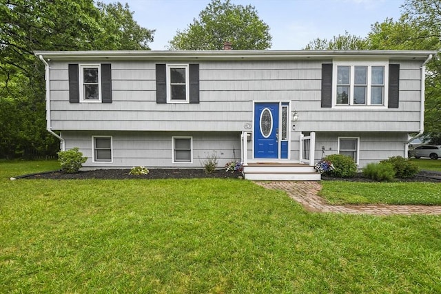 74 S Douglas St, Rockland, MA 02370 - raised ranch featuring a front yard