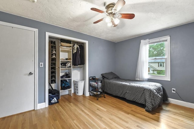 74 S Douglas St, Rockland, MA 02370 - bedroom featuring wood finished floors, a textured ceiling, ceiling fan, and a closet