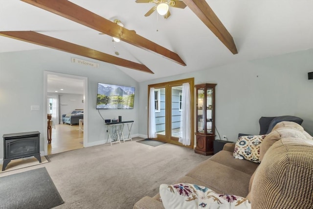 74 S Douglas St, Rockland, MA 02370 - carpeted living area with a wood stove and ceiling fan