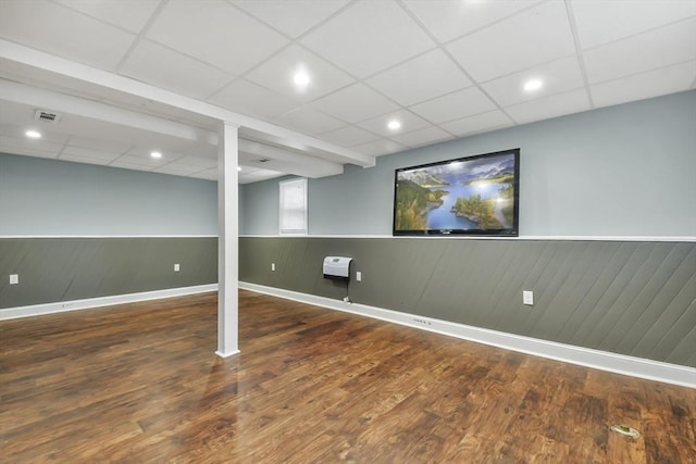 74 S Douglas St, Rockland, MA 02370 - finished below grade area with a wainscoted wall, wood finished floors, a drop ceiling, and recessed lighting