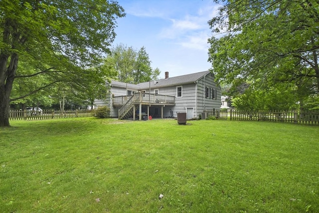 74 S Douglas St, Rockland, MA 02370 - rear view of property with stairs, a wooden deck, a fenced backyard, and a chimney