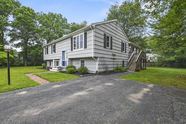 74 S Douglas St, Rockland, MA 02370 - view of front of home featuring a front yard and stairway