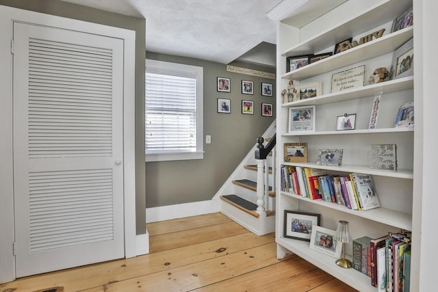 staircase featuring hardwood / wood-style floors