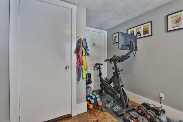 exercise area with a textured ceiling