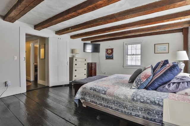 bedroom featuring dark hardwood / wood-style flooring and beamed ceiling