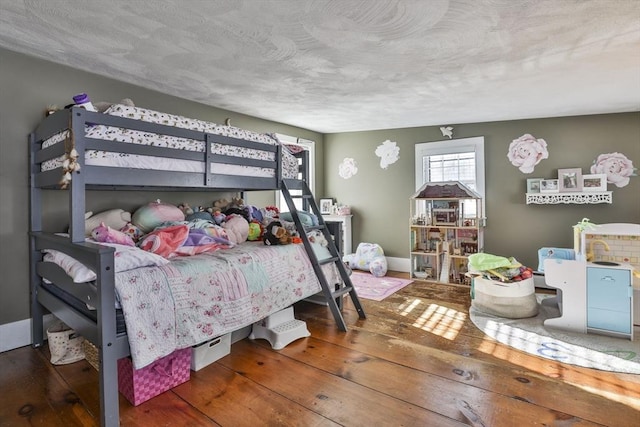 bedroom featuring dark wood-type flooring