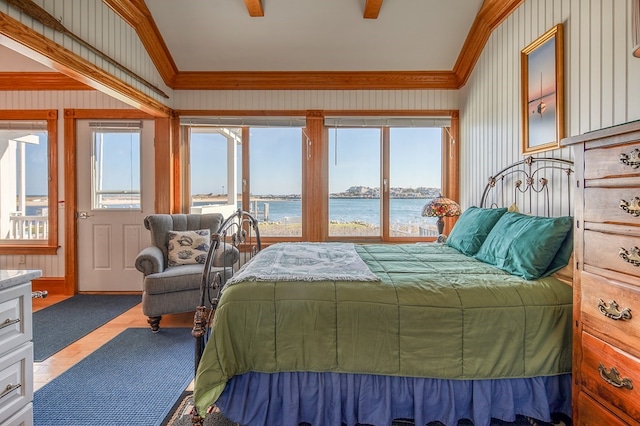 tiled bedroom with ceiling fan, crown molding, a water view, and multiple windows