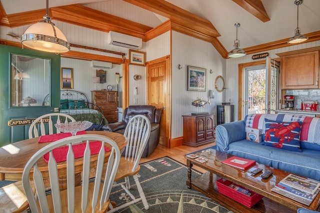 dining area with vaulted ceiling with beams, a wall unit AC, and light hardwood / wood-style floors