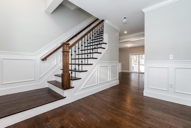 stairs featuring hardwood / wood-style flooring and crown molding