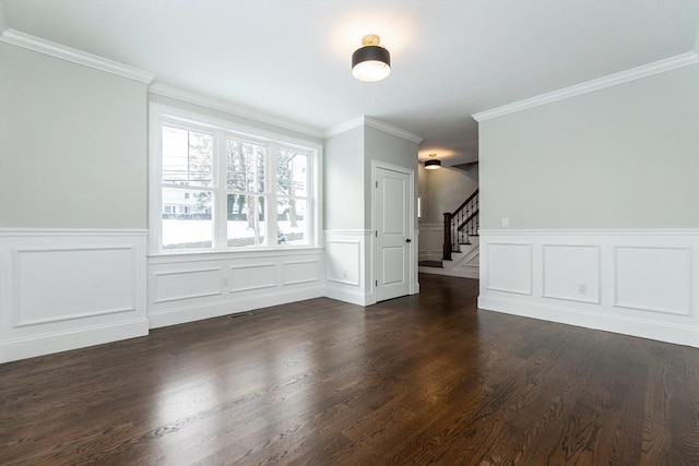 unfurnished room featuring crown molding and dark hardwood / wood-style flooring