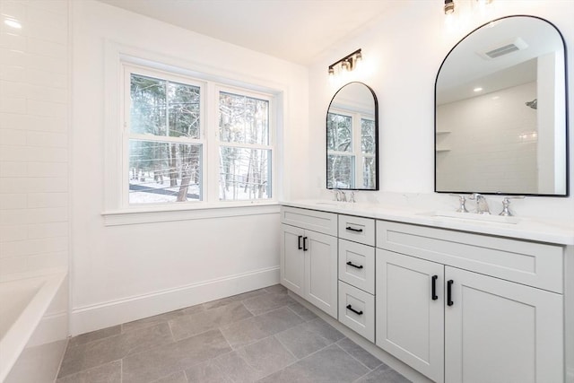 bathroom with vanity and shower / bathtub combination