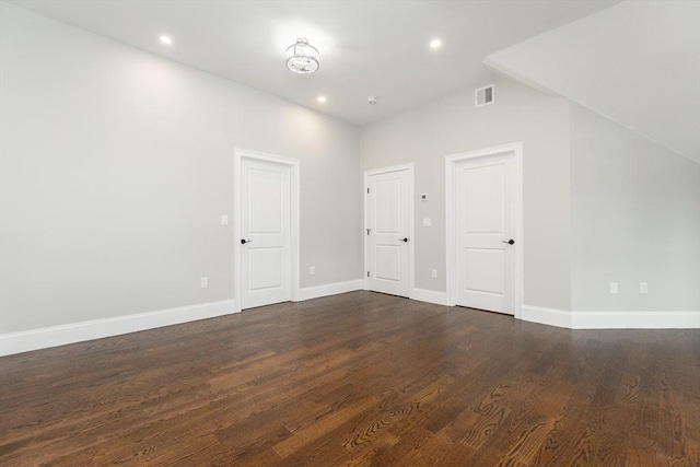 additional living space featuring dark hardwood / wood-style flooring