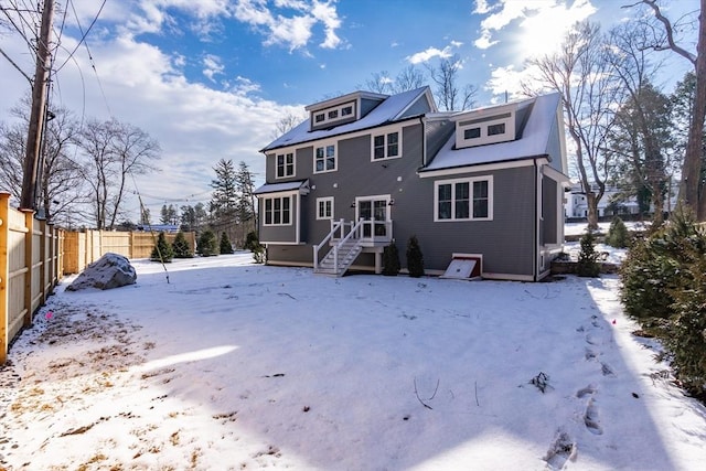 view of snow covered house