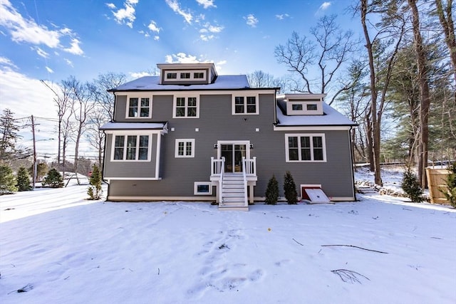 view of snow covered house