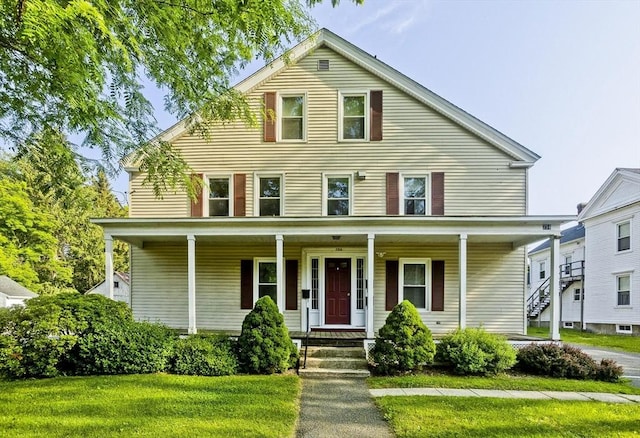734 Main St, Amherst, MA 01002 - view of front of property with covered porch and a front yard