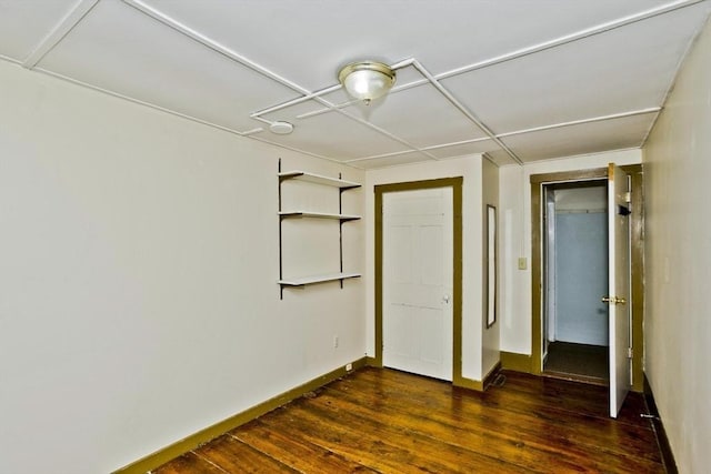 734 Main St, Amherst, MA 01002 - unfurnished bedroom featuring dark wood finished floors and baseboards
