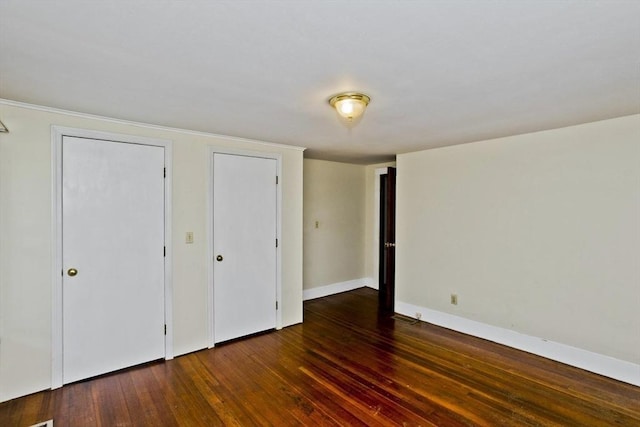 734 Main St, Amherst, MA 01002 - unfurnished bedroom featuring wood finished floors and baseboards