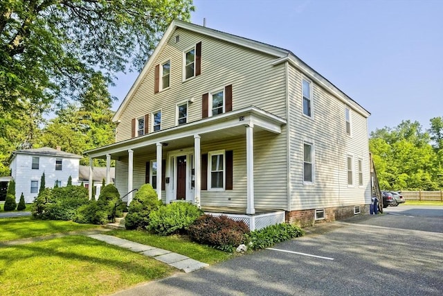 734 Main St, Amherst, MA 01002 - view of front facade featuring a porch and a front yard