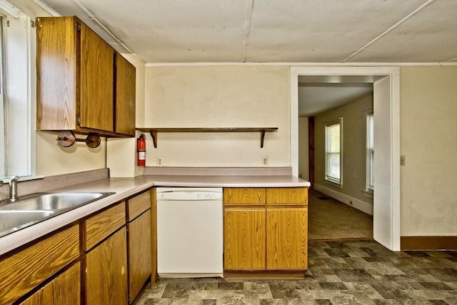 734 Main St, Amherst, MA 01002 - kitchen with white dishwasher, a sink, light countertops, and brown cabinets