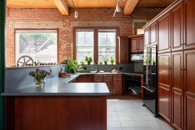 543 Green St, Cambridge, MA 02139 - kitchen featuring black appliances, a wood ceiling with exposed beams, brick wall, a peninsula, and light tile patterned floors