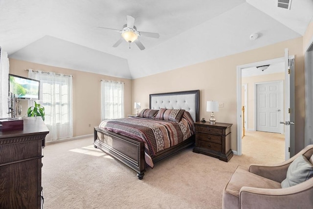 carpeted bedroom featuring ceiling fan and vaulted ceiling