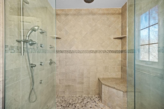 bathroom with a tile shower