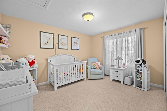 carpeted bedroom featuring a crib