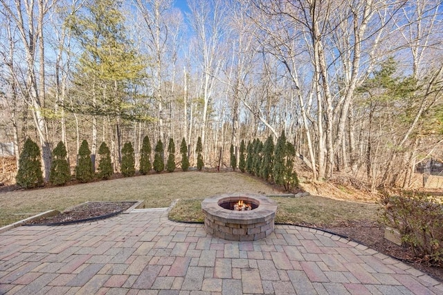 view of patio with a fire pit