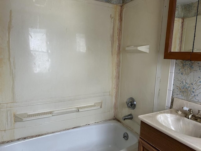 bathroom with vanity and a bathing tub