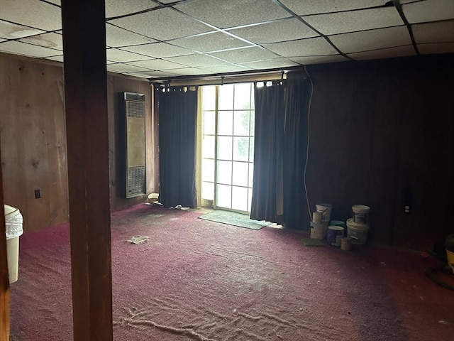 unfurnished room with carpet flooring and a paneled ceiling