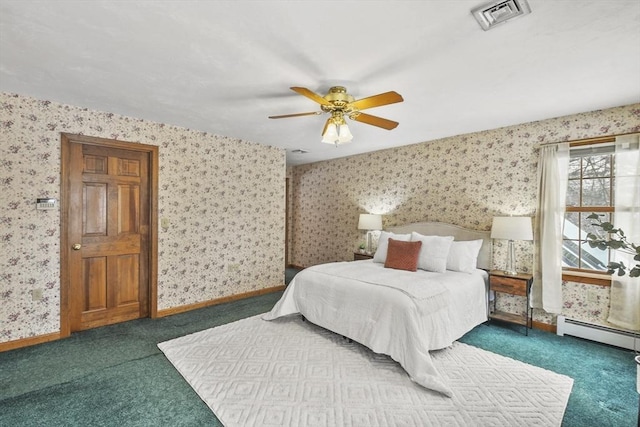 bedroom featuring a baseboard heating unit, carpet, and ceiling fan